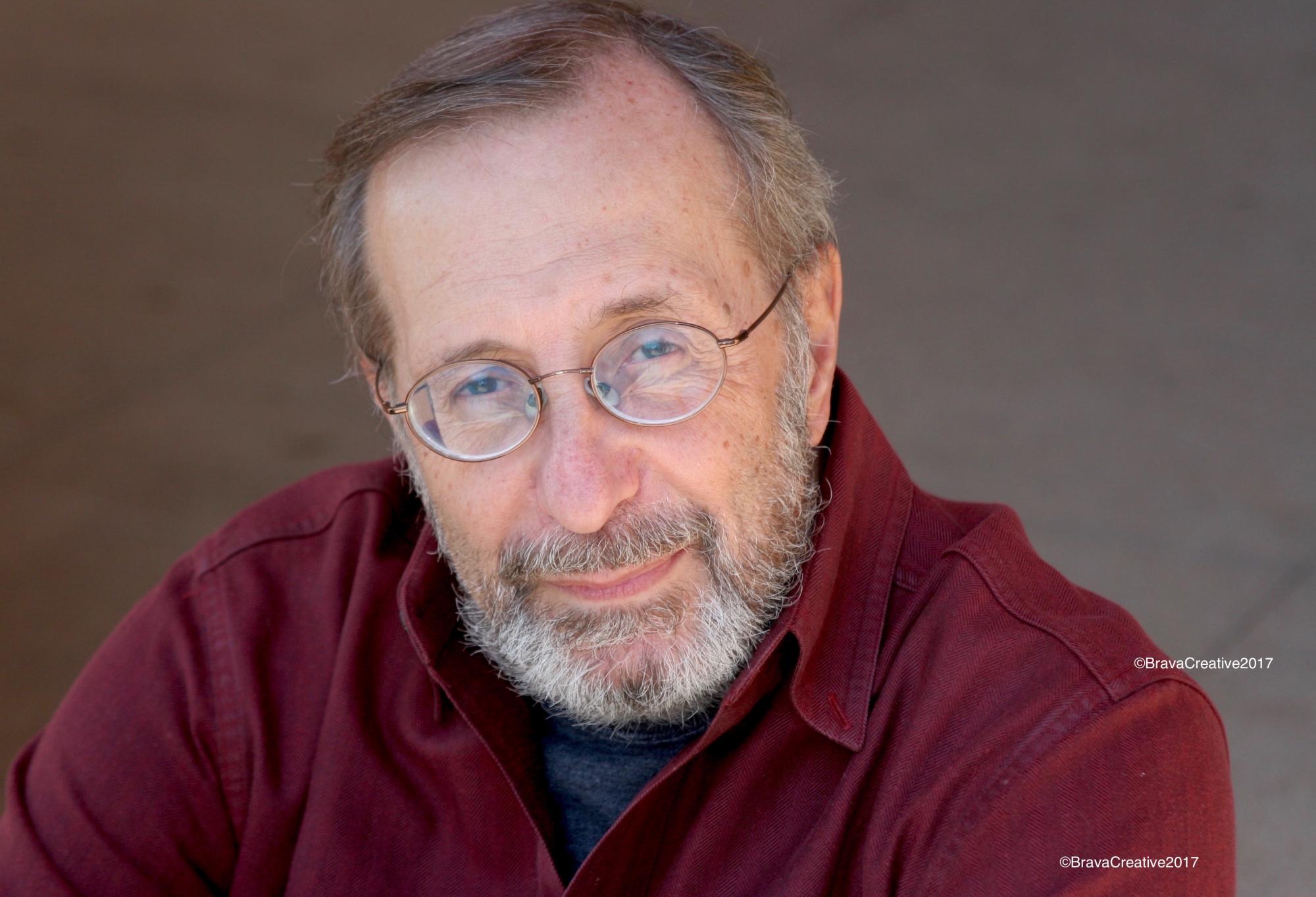 Headshot of Loft teaching artist John DeDakis