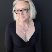 Woman against dark background